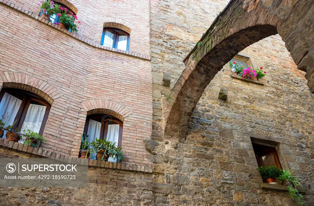 Italy, Volterra, an ancient arched structure supporting the Pretorio palace