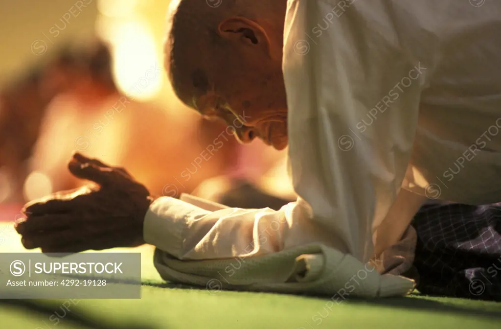 Burma, Mandalay, senior man praying