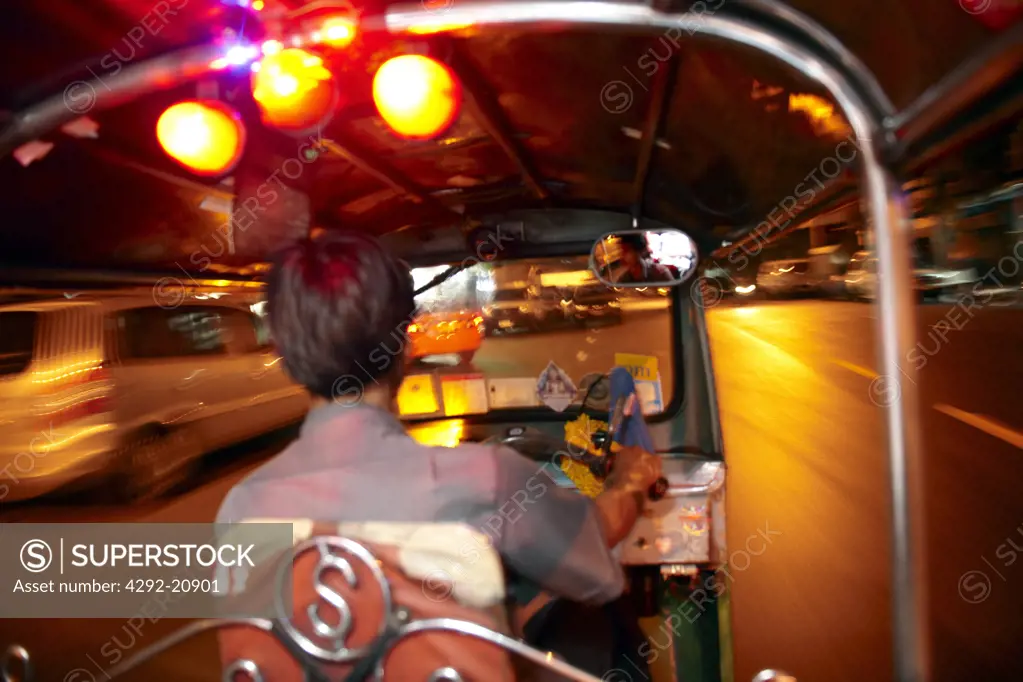 Thailand, Bangkok, Tuk Tuk Taxi Driver at night