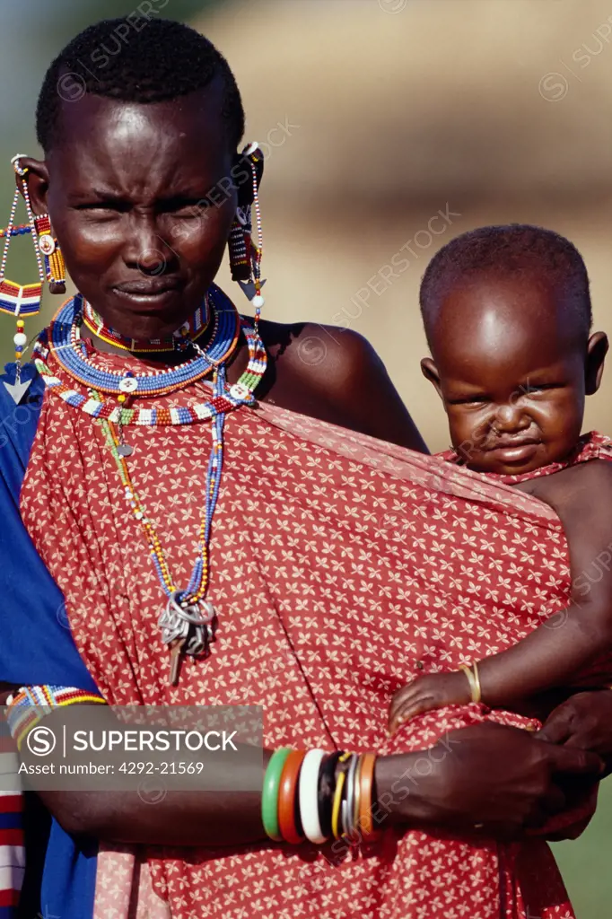 Africa, Kenya. Masai woman with baby