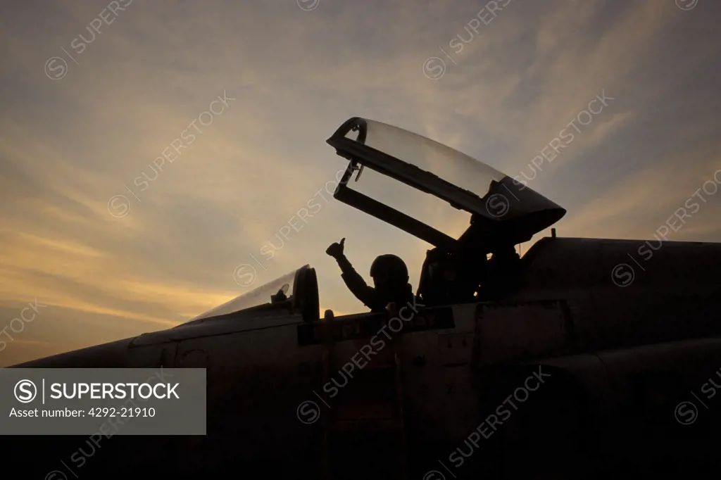 Jet Fighter pilot at sunset