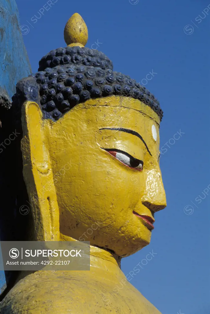Nepal, Katmandu. Buddha statue at the Swoyambhunath temple