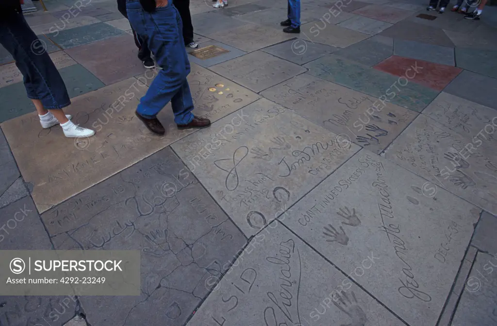 Hand and shoeprints of celebrities outside of Mann's Chinese Theater, Los Angeles, California, USA