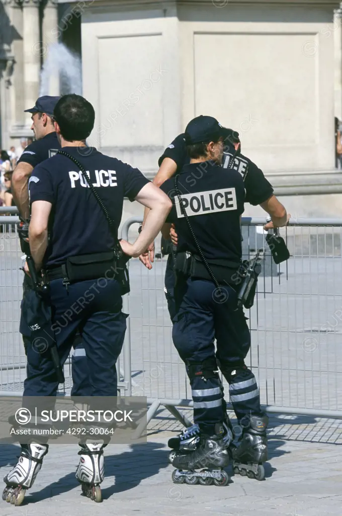 France, Île-de-France, Paris, The Louvre, police on skates