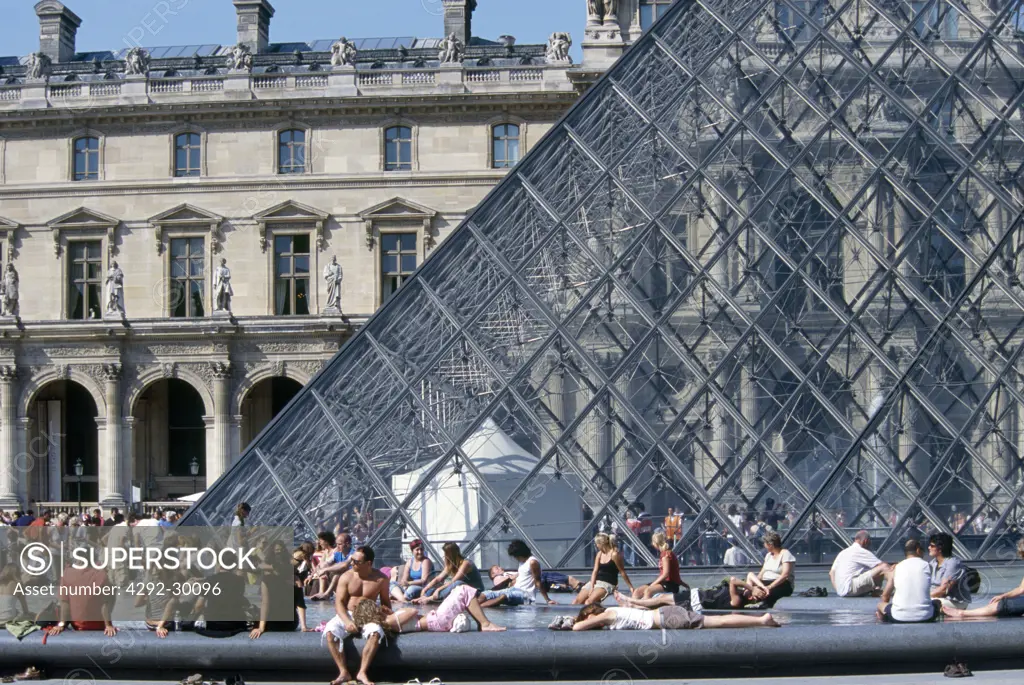 France, Île-de-France, Paris, The Louvre, the Pyramid with tourists