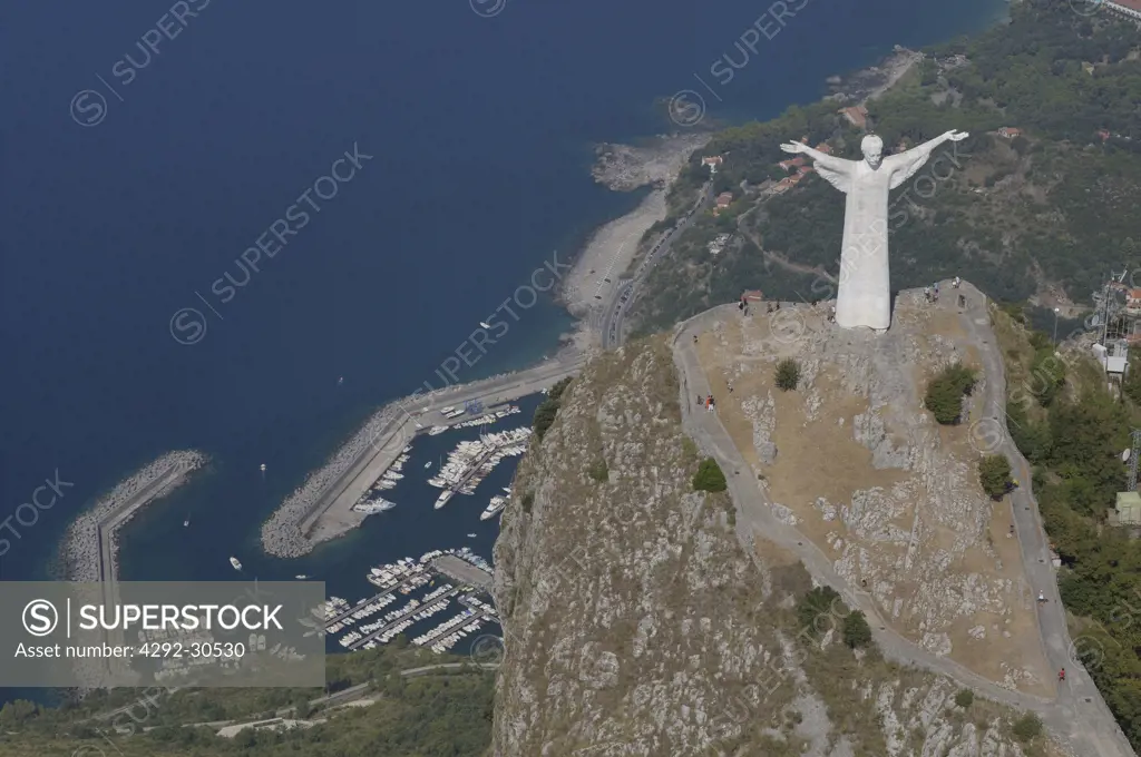 Italy, Basilicata, Maratea Jesus Christ statue on San Biagio Mount,aerial view