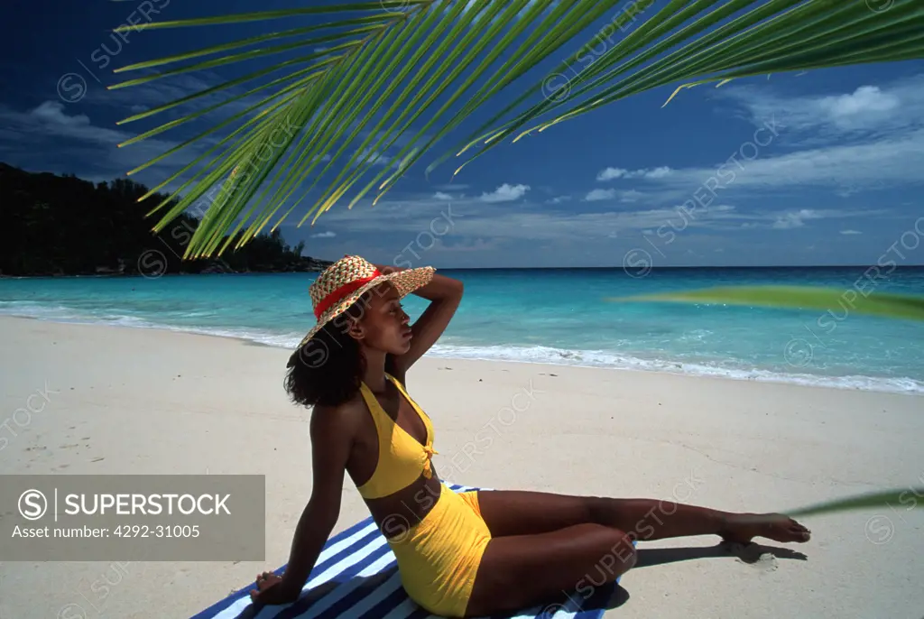 Seychelles Indian Ocean Mahe Young woman on beach Intendance bay