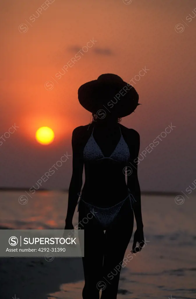 Woman at sunset silhouette