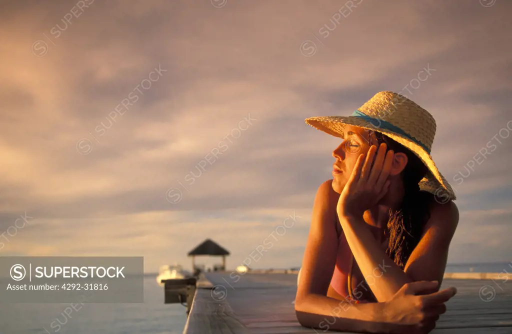 Maldives, Ari Atoll, White Sands Island. Woman on beach