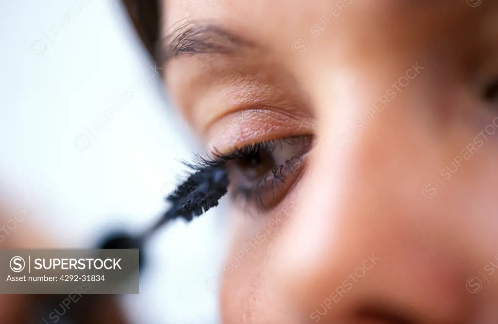 Woman putting on make up