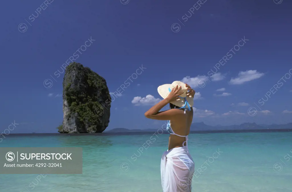 Thailand, Krabi. Koh Podah Island. Woman on beach