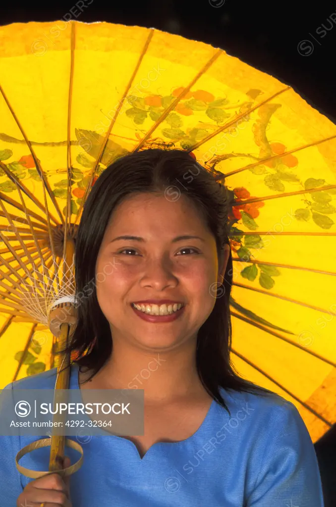 Thailand, Chiang Mai. Sa Paper umbrella factory. Woman with paper umbrella