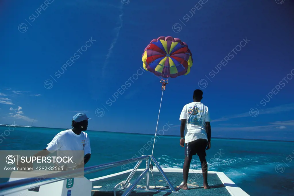 UK, Turks and Caicos Islands, Providenciales: parasailing at Grace Bay