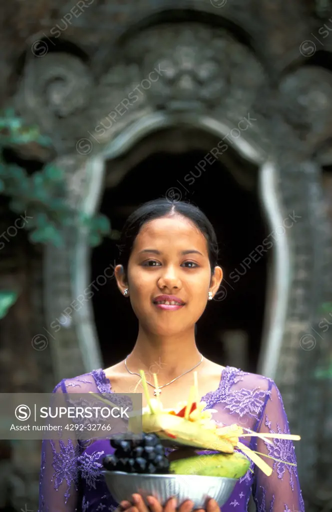 Indonesia, Bali, balinese woman making offerings to Gods
