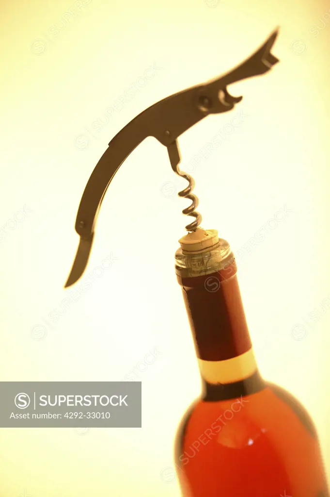 Corkscrew opening bottle of wine