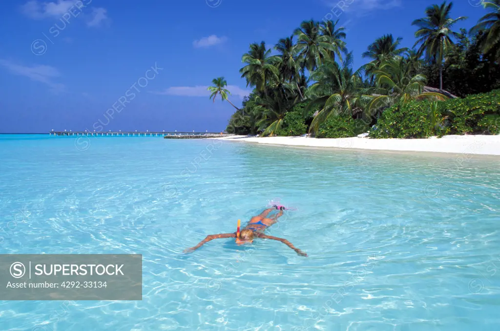 Maldives Islands. Woman on tropical beach