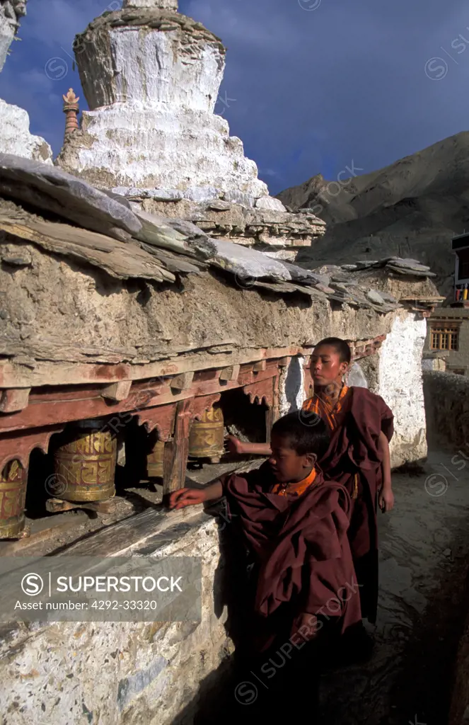 India, Jammu and Kashmir, Ladakh, Chortens Stupa, novice monk at Lamayuru Monastery