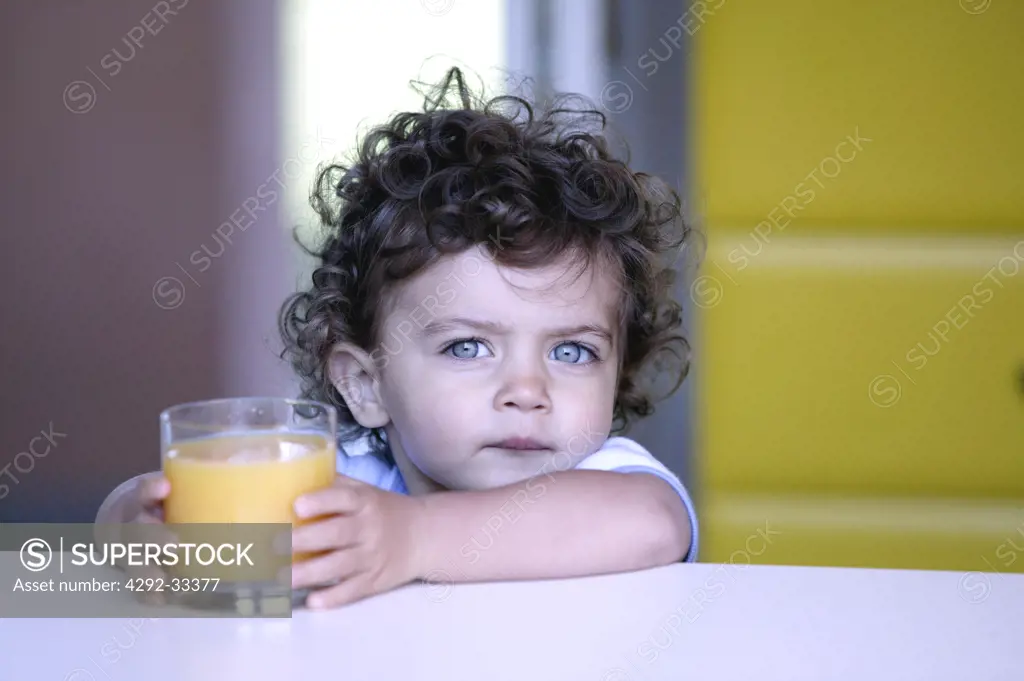 Little girl with orange juice