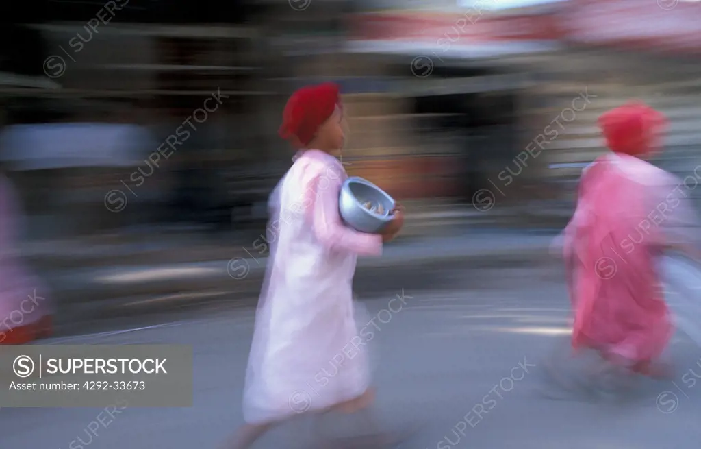 Burma, Mandalay, buddhist nuns(Bhikkuni) going for morning alms