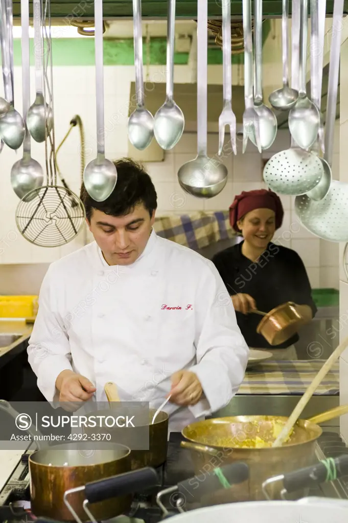 Italy, Lombardy, Bergamo, chef Darwin Foglieni at work in the kitchen of Ol Giupi e la Margi restaurant