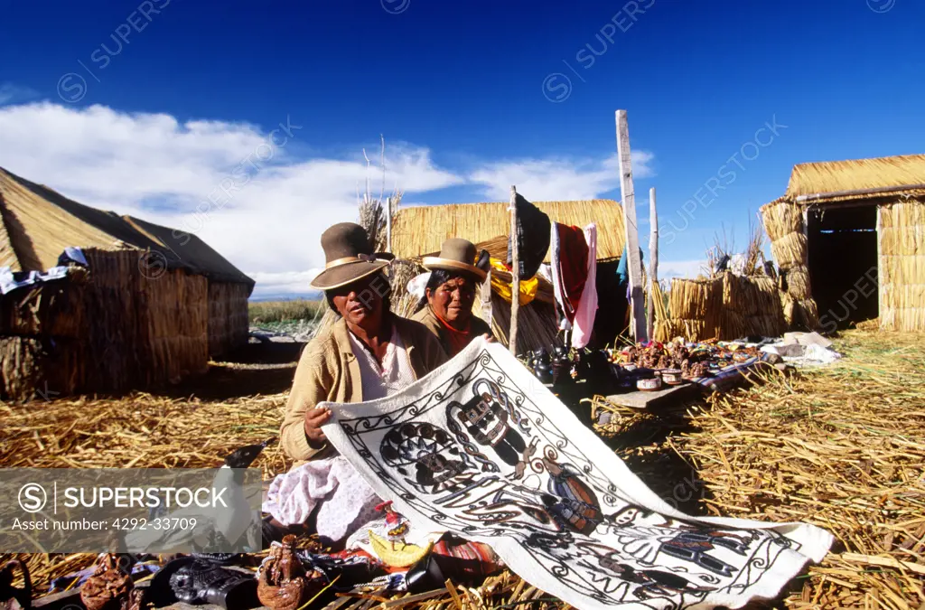 Peru, Lake Titicaca, Los Uros floating islands, native women selling souvenirs