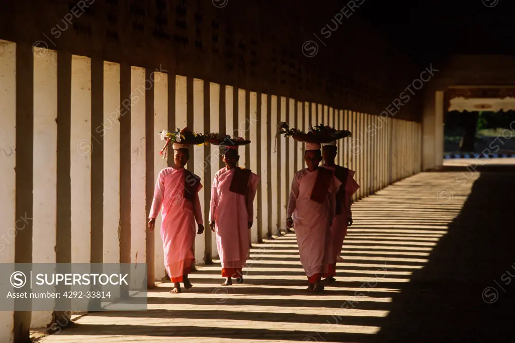 Burma, Bagan, walkway to Shwezigon Pagoda, nuns