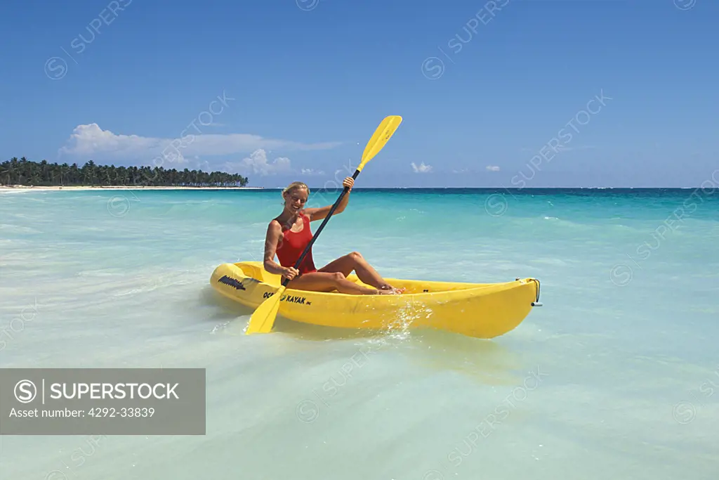 Dominican Republic, Punta Cana, woman on canoe