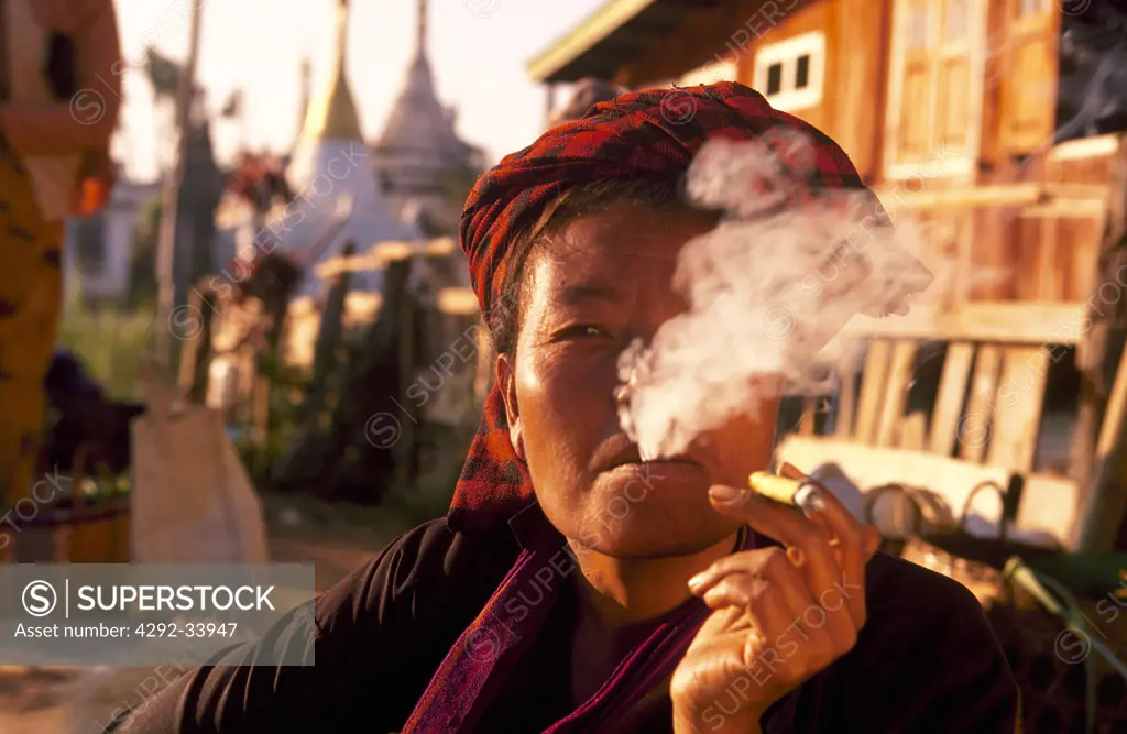 Myanmar, Burma, Shan State, Inle lake, Pa-O tribe woman smoking