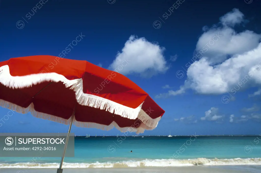 Caribbean, St. Martin, Friar's Bay, beach umbrella on the beach