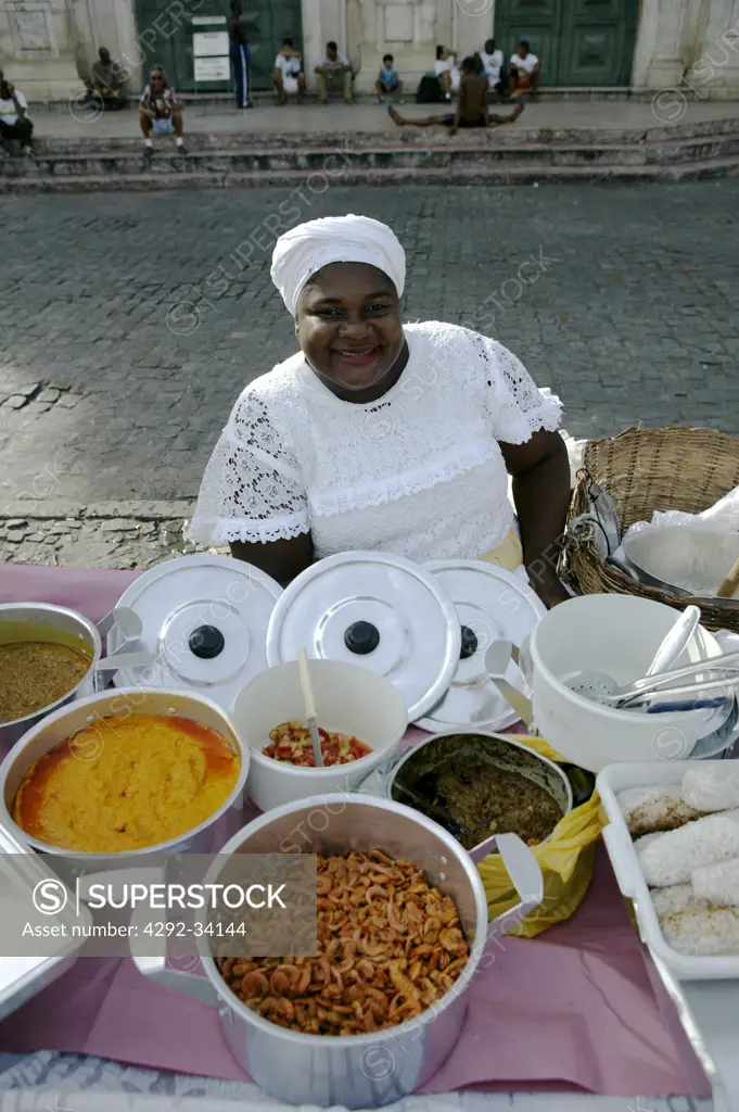 Brazil. Bahia. Salvador de Bahia. Pelourinho historical district. Bahia Woman with typical Bahia costume selling food