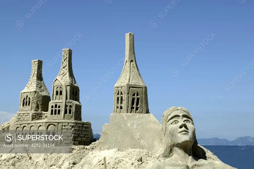 Brazil, Rio De Janeiro, Copacabana Beach. Sand castle and sand woman.