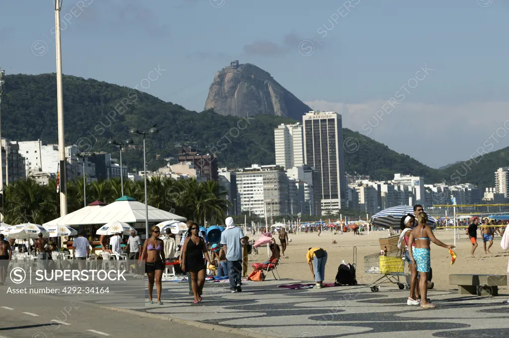 Brazil, Rio De Janeiro, Copacabana Beach and Avenida Atlantica. Sugarloaf in background