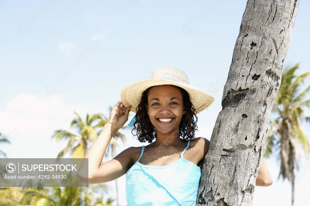 Woman's portrait with straw hat