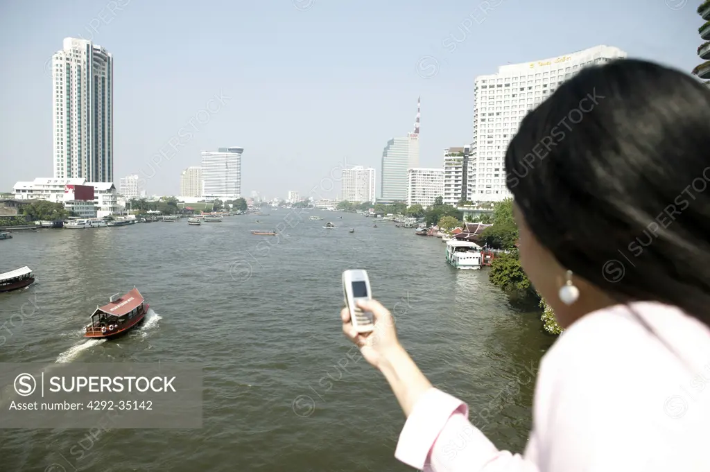 Thailand, Bangkok, woman with cell phone