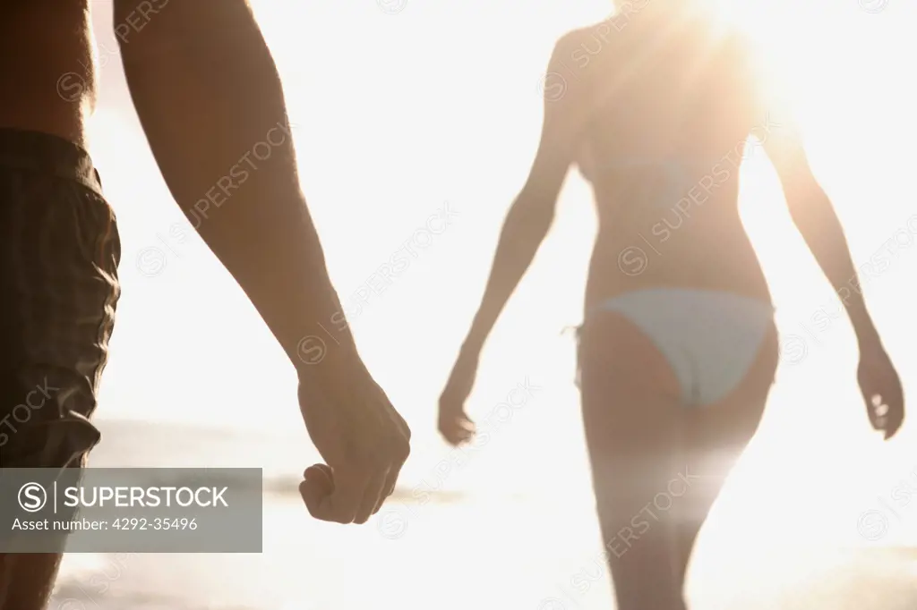 Couple at the seaside, backlit