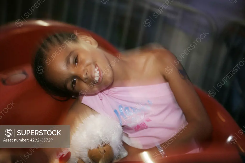 Usa, New York, Coney Island, girl at amusement park