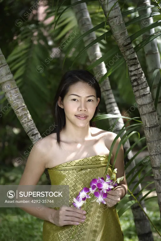 Thailand, Koh Samui Island, Thai woman with orchids