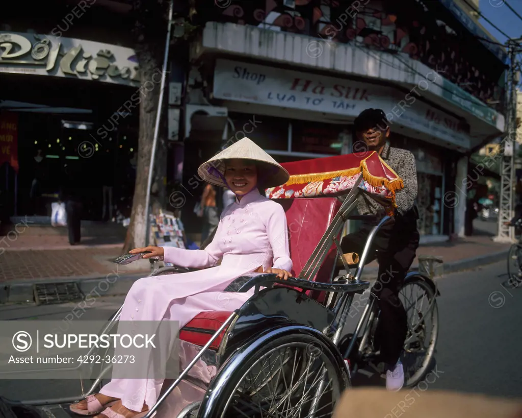 Vietnam, Hanoi, Vietnamese woman on rickshaw
