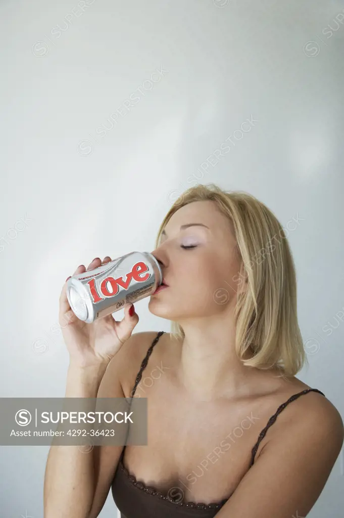 Woman drinking out of can