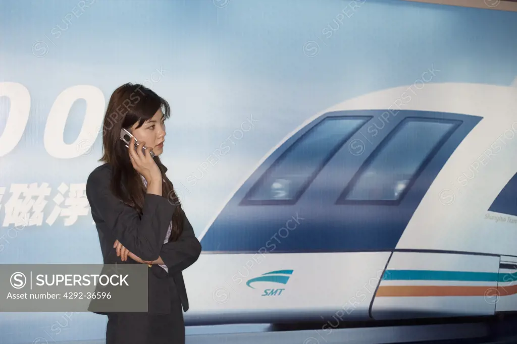 China. Shanghai. Chinese woman at Shanghai airport, at the Maglev (Magnetic Levitation) train station (NO property release!)