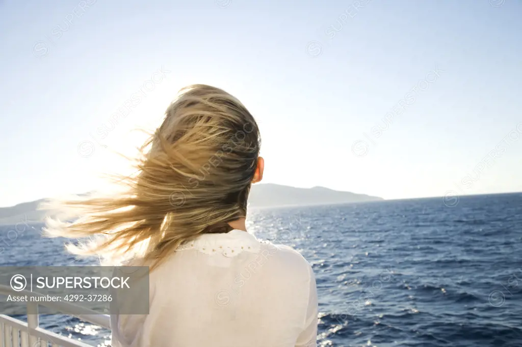 Greece. Cyclades Islands. Mykonos,woman looking sea.