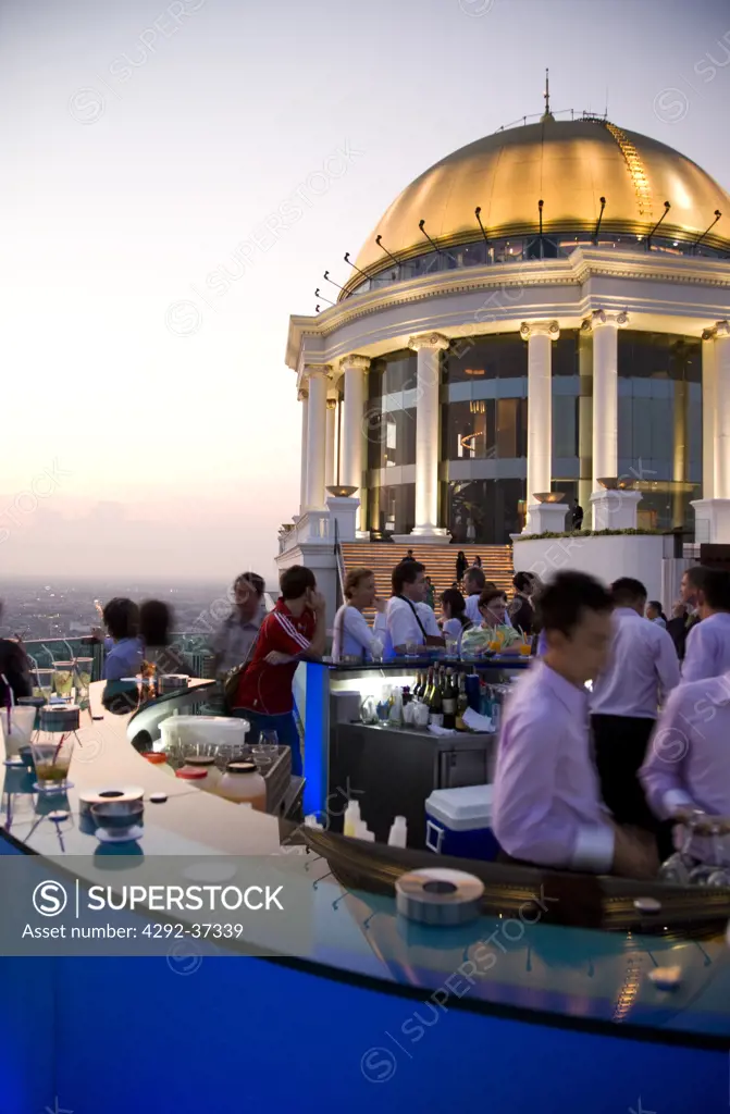 Thailand, Bangkok, Sirocco Bar, on State Tower Buiding, People relax in the bar.