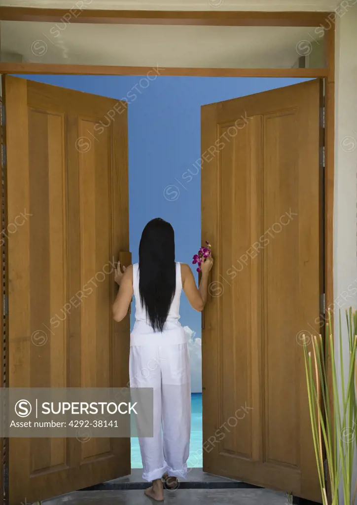 Woman opening door