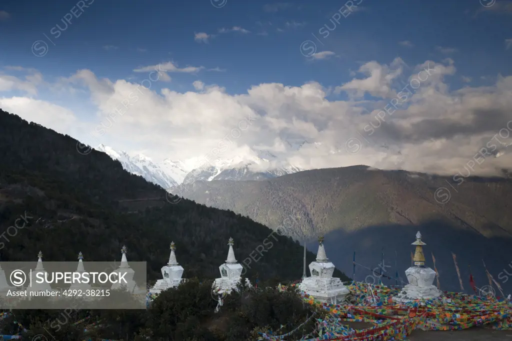 China, Yunnan, Shangri-La (Zhongdian) on Tibetan border buddhist stupa.In background Meili Snow Mountains