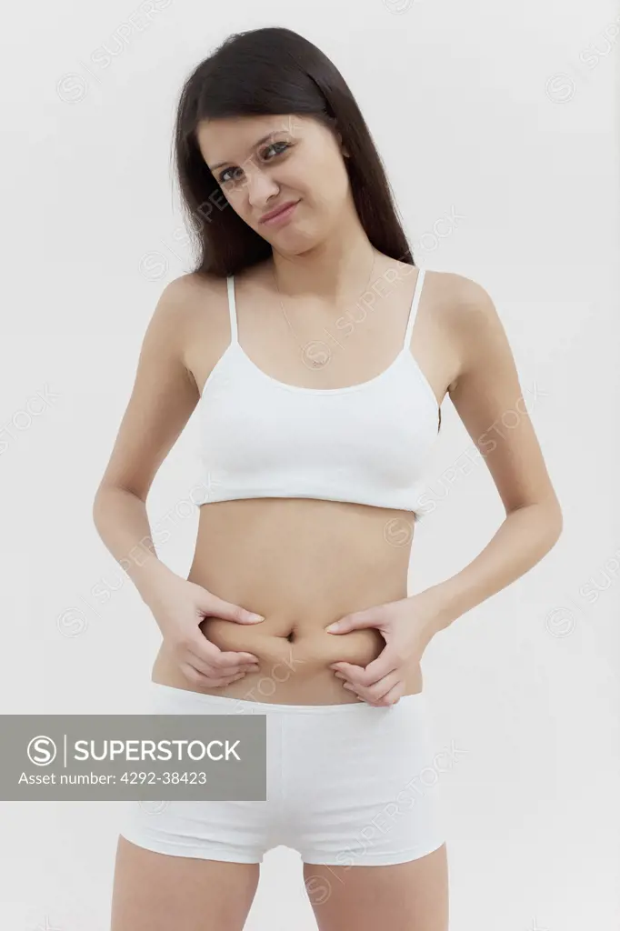 Woman pinching belly