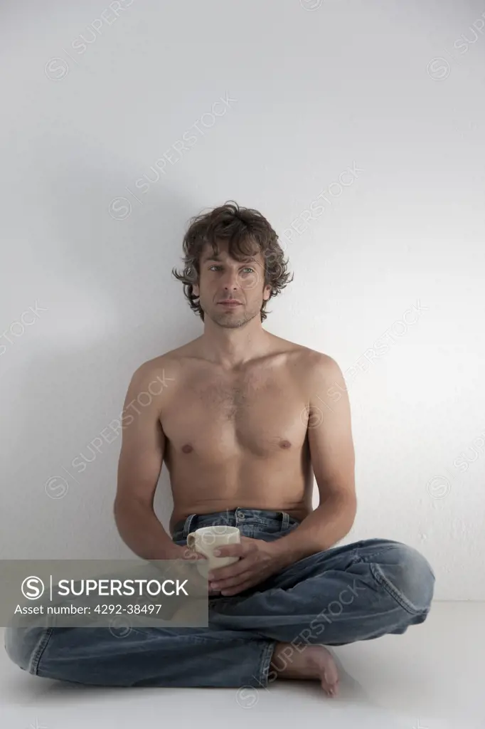 Studio shot of man with cup