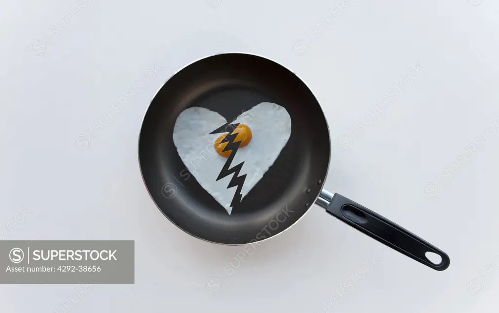Broken heart shaped fried egg
