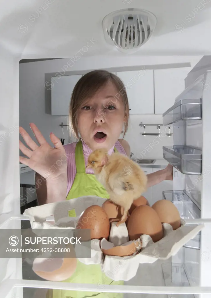 Woman looking in the fridge