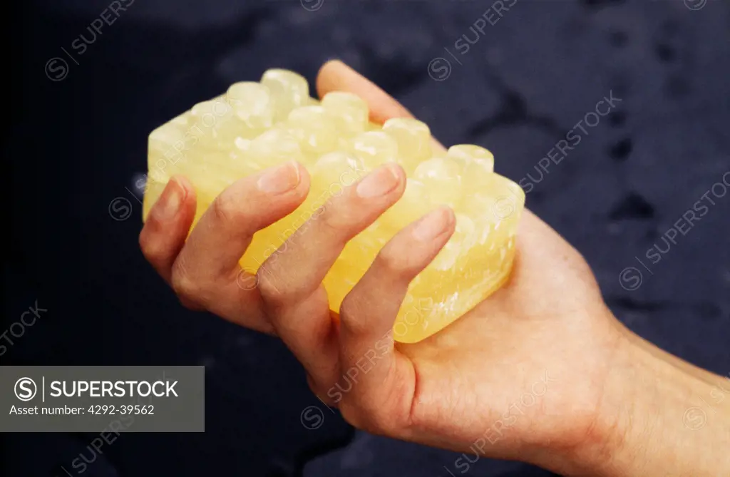 Woman's hand holding a bar of soap