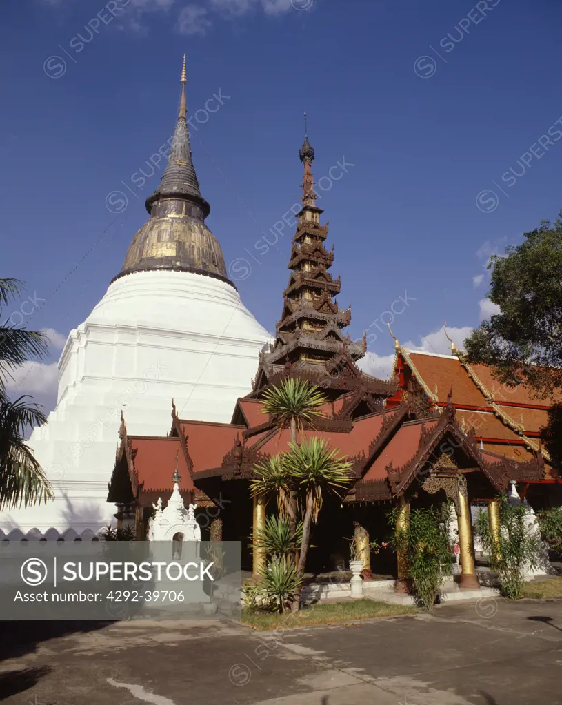 Wat Phra Kaew Don Tao, Lampang, with a burmese devotional pavilion in front of the main Chedi. Lampang,Thailand